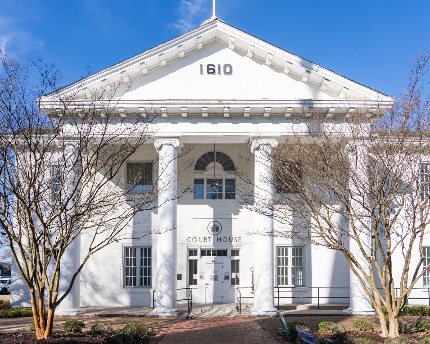 The neoclassical facade of a historic county courthouse.